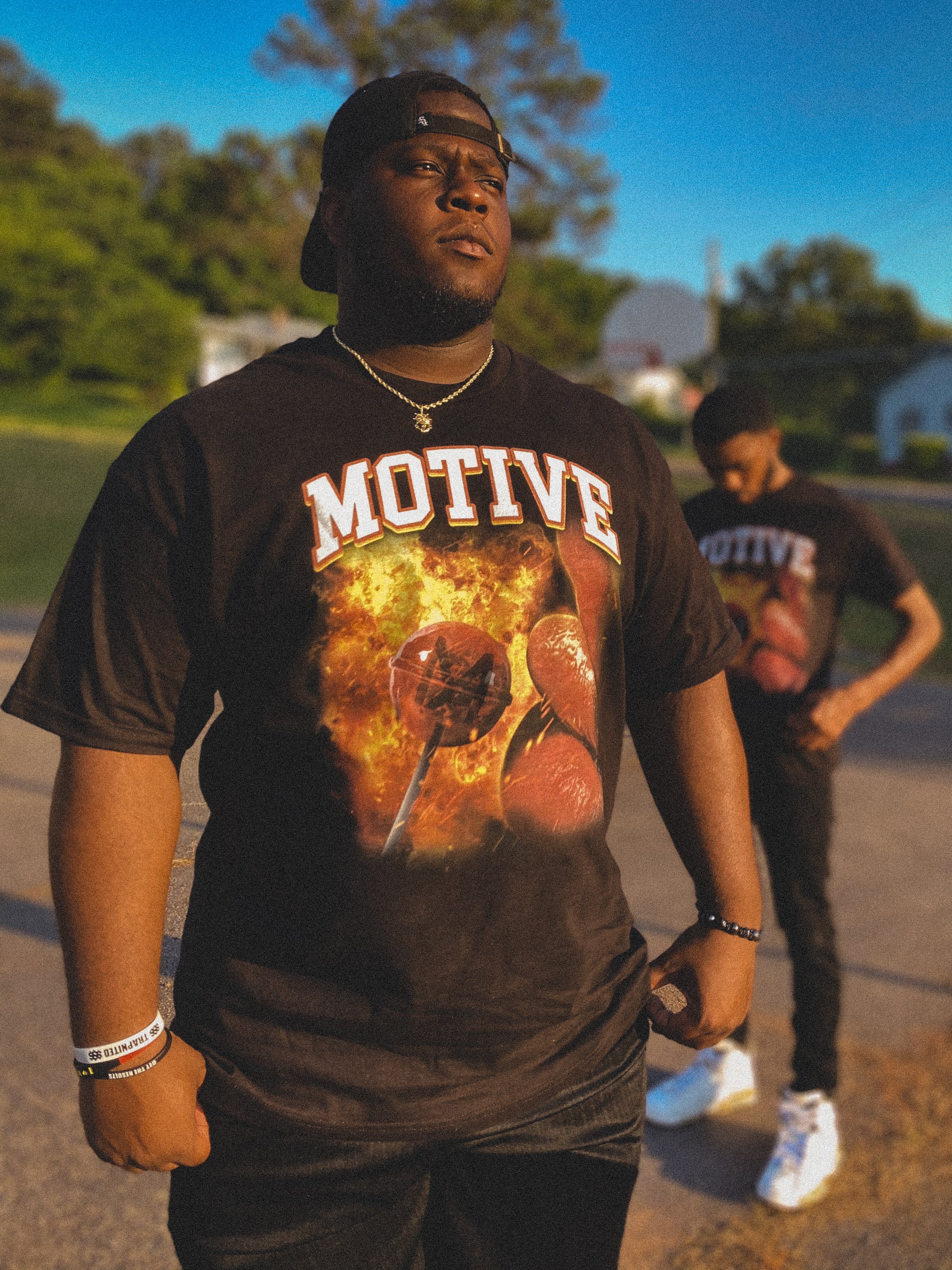 two men wearing black doomsday tee